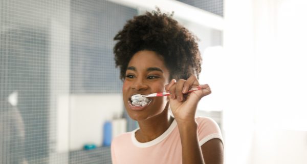 Teenage girl brushing her teeth.