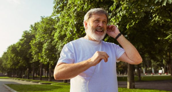 senior-man-as-runner-with-fitness-tracker-city-s-street-caucasian-male-model-using-gadgets-while-jogging-cardio-training-summer-s-morning-healthy-lifestyle-sport-activity-concept